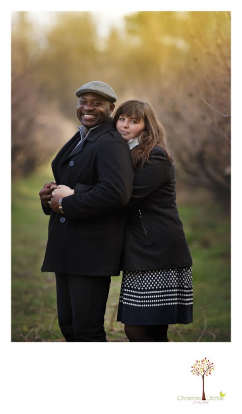 Sonora engagement and wedding photographer Christine Dibble Photography takes photos at Indigeny Reserve of the bride and groom among the apple orchard rows of trees.