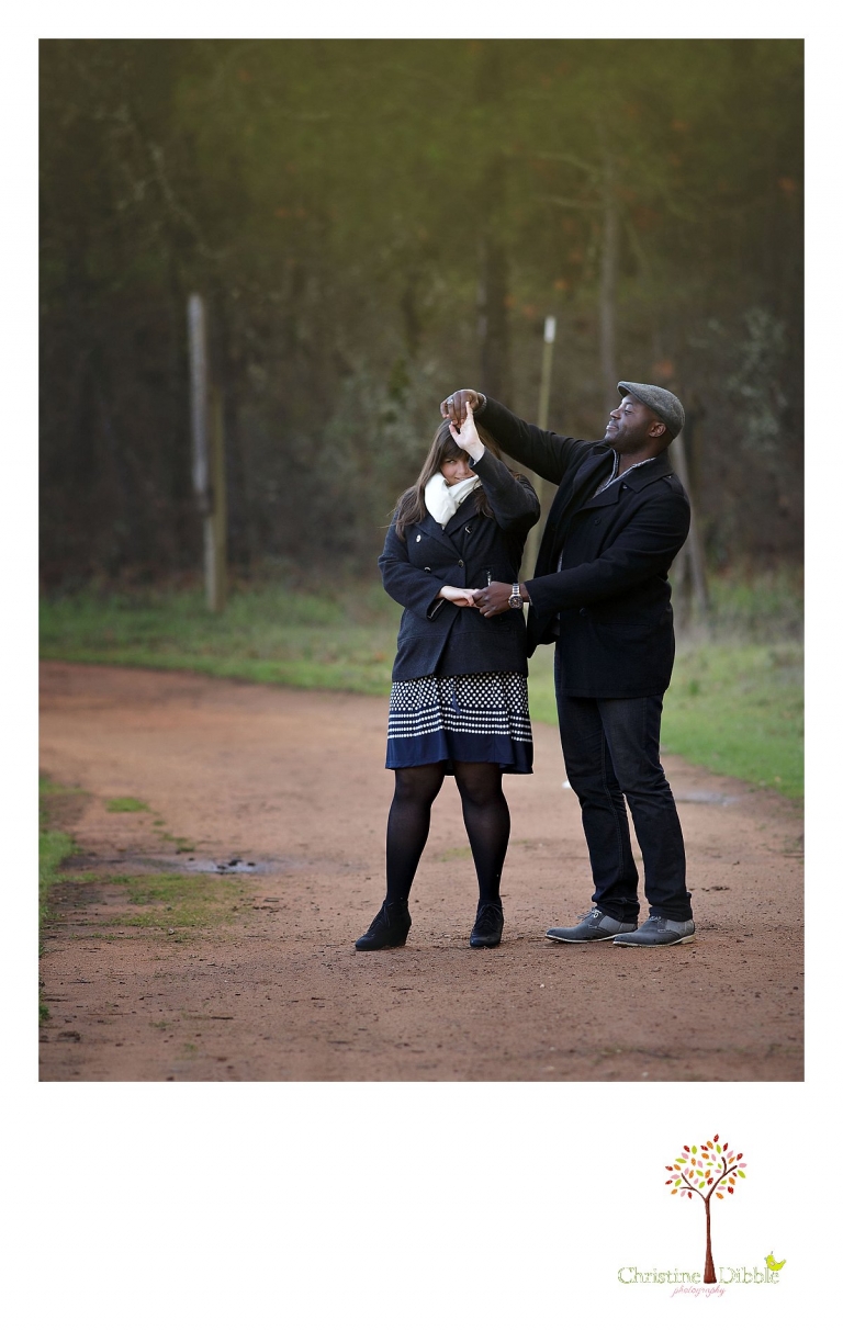 Sonora engagement and wedding photographer Christine Dibble Photography takes photos at Indigeny Reserve of a bride and groom spinning as they dance on a dirt trail.