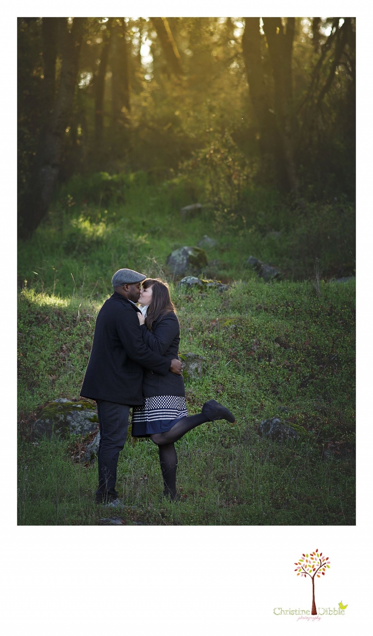 Sonora engagement and wedding photographer Christine Dibble Photography takes photos at Indigeny Reserve as the bride kicks her foot behind her as she and the groom kiss.
