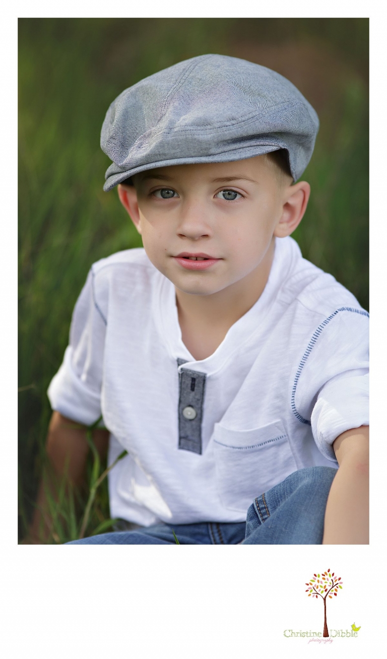 Sonora family photographer Christine Dibble Photography takes outdoor family photos at Indigeny Reserve of a little boy by himself in a newsboy cap.