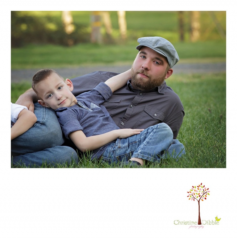 Sonora family photographer Christine Dibble Photography takes outdoor family photos at Indigeny Reserve of a dad and his son resting on the grass.