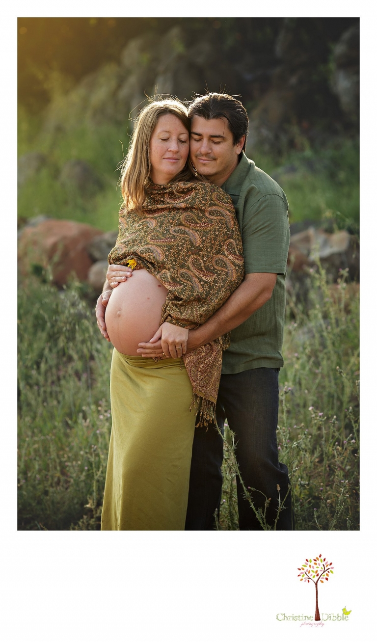Sonora maternity photographer Christine Dibble Photography photographs a dad and mother-to-be as they pose during a pregnancy maternity portrait session at sunset.