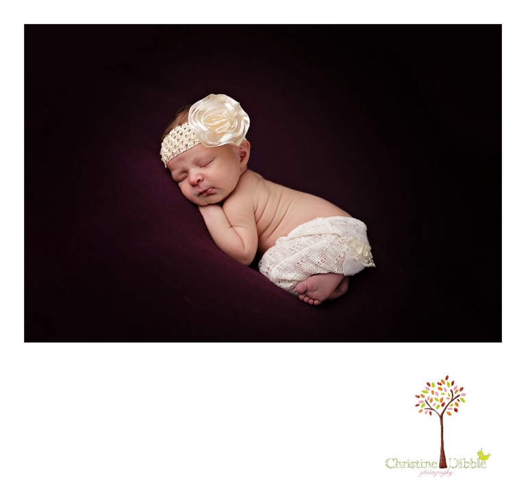 Best Sonora newborn photographer Christine Dibble Photography takes indoor studio photos of a newborn baby girl wearing pants by Bonnie's Bonnets by Jess.