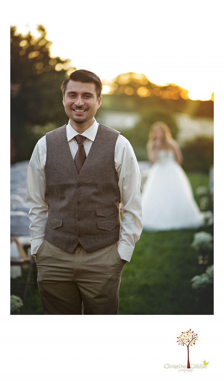 The groom waits to turn to see his bride for the first look at sunrise while photographed by Don Pedro Hacienda photographer Christine Dibble Photography of Sonora.