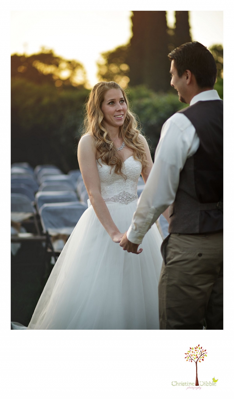 A bride smiles at her groom after seeing him for the first time at sunrise on their wedding day as they are photographed by Don Pedro Hacienda photographer Christine Dibble Photography of Sonora.