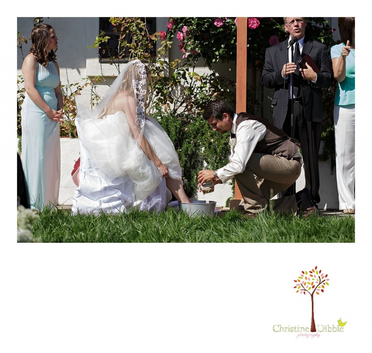 A groom washes his bride's feet during a wedding ceremony photographed by Don Pedro Hacienda photographer, Sonora wedding photographer Christine Dibble Photography.