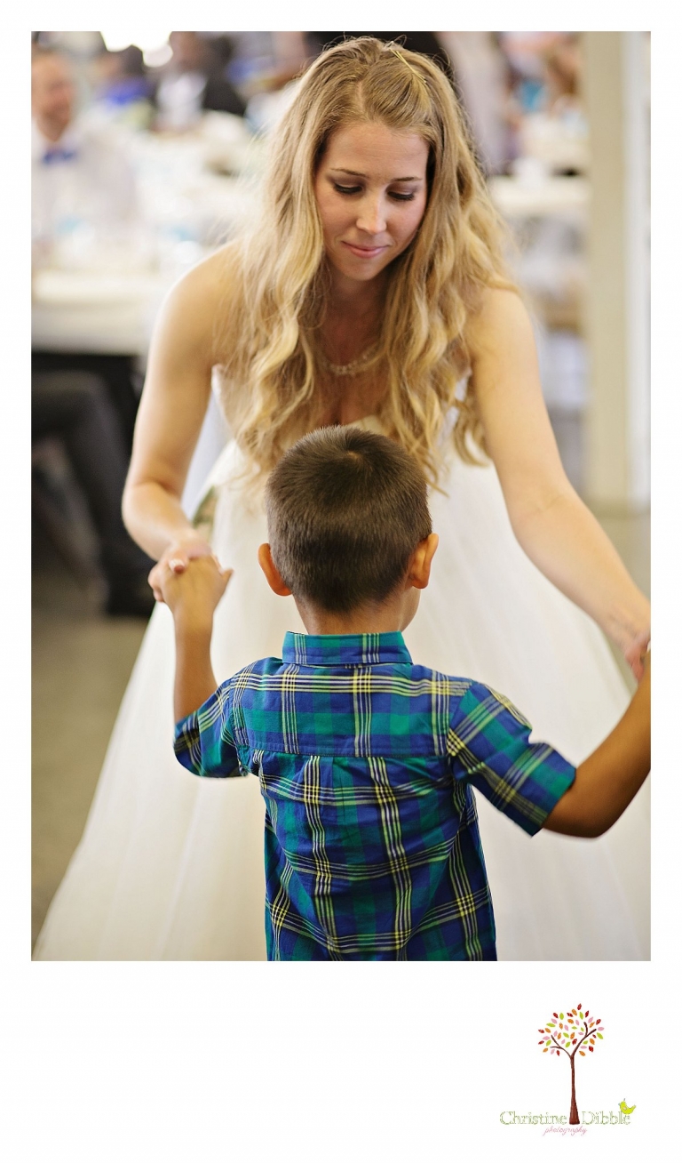 Don Pedro Hacienda photographer, Sonora wedding photographer Christine Dibble Photography photographs a bride dancing with a young boy.