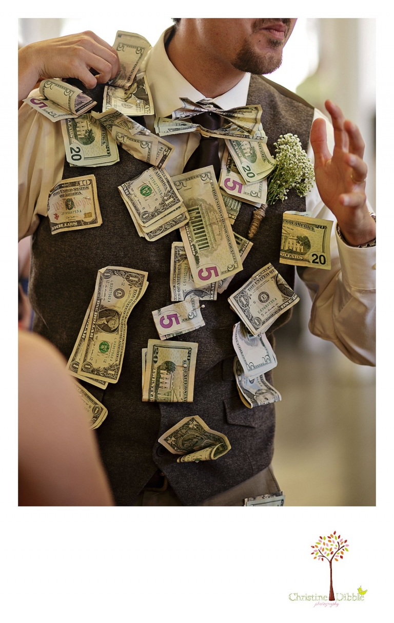 Don Pedro Hacienda photographer, Sonora wedding photographer Christine Dibble Photography takes photos of the groom covered in money pinned to his vest during the money dance.