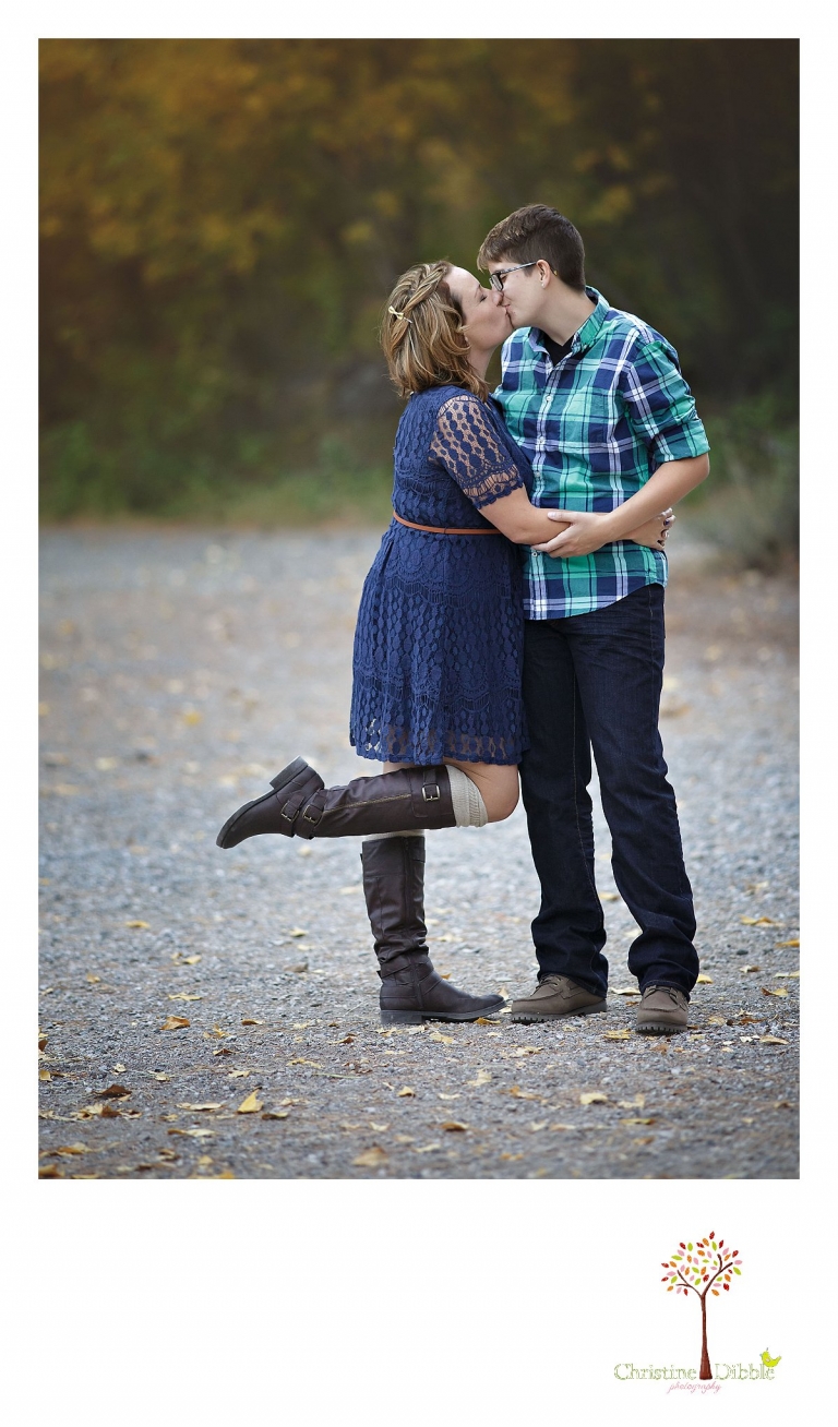 Sonora and Reno family and wedding photographer Christine Dibble Photography captures a couple sharing a kiss during a family portrait session at Galena Park.