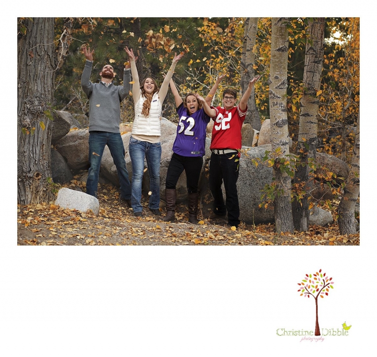 Sonora and Reno family and wedding photographer Christine Dibble Photography captures a family as they throw fall leaves in the air during a photo shoot at Reno's Galena Park.