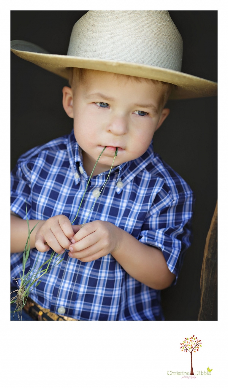 Sonora child photography by Christine Dibble Photography captures a three year old boy in a head shot as he wears a cowboy hat.
