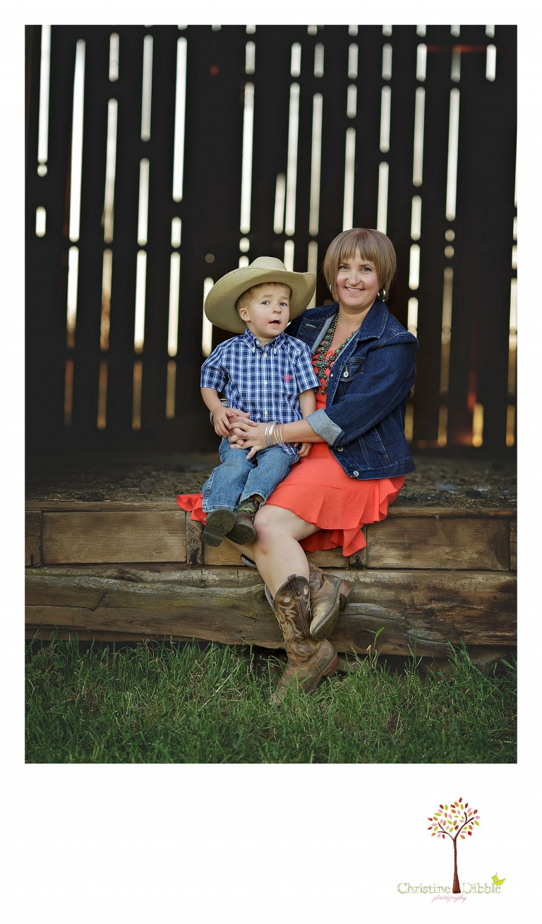 Sonora child photography by Christine Dibble Photography captures a three year old boy and his mom sitting in the doorway of an historic barn.