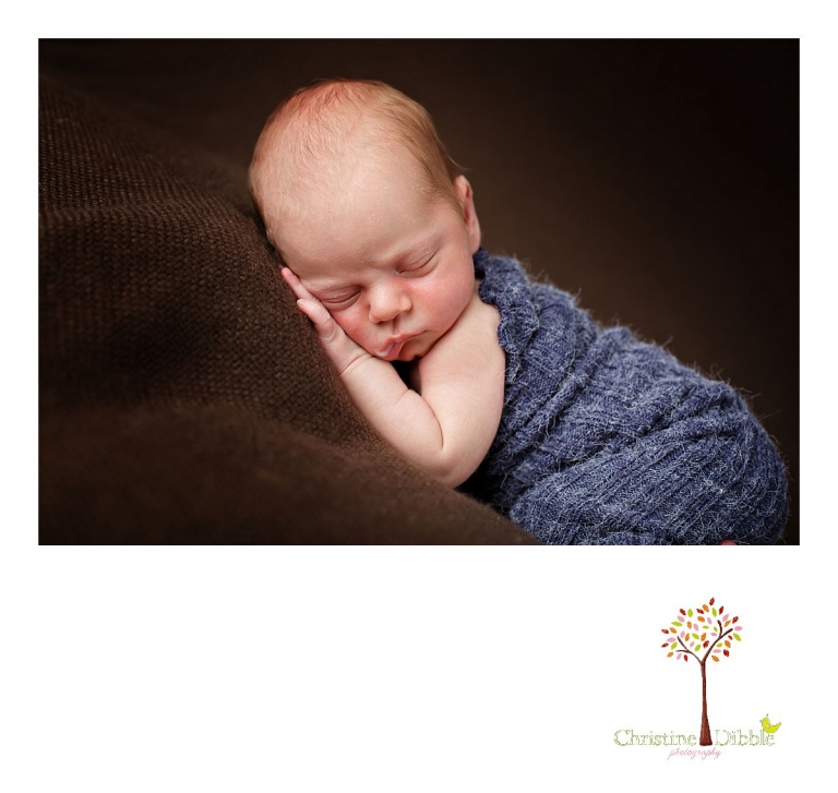 Best Sonora newborn photographer Christine Dibble Photography takes photos of a nine day old baby boy sleeping and dribbling milk.