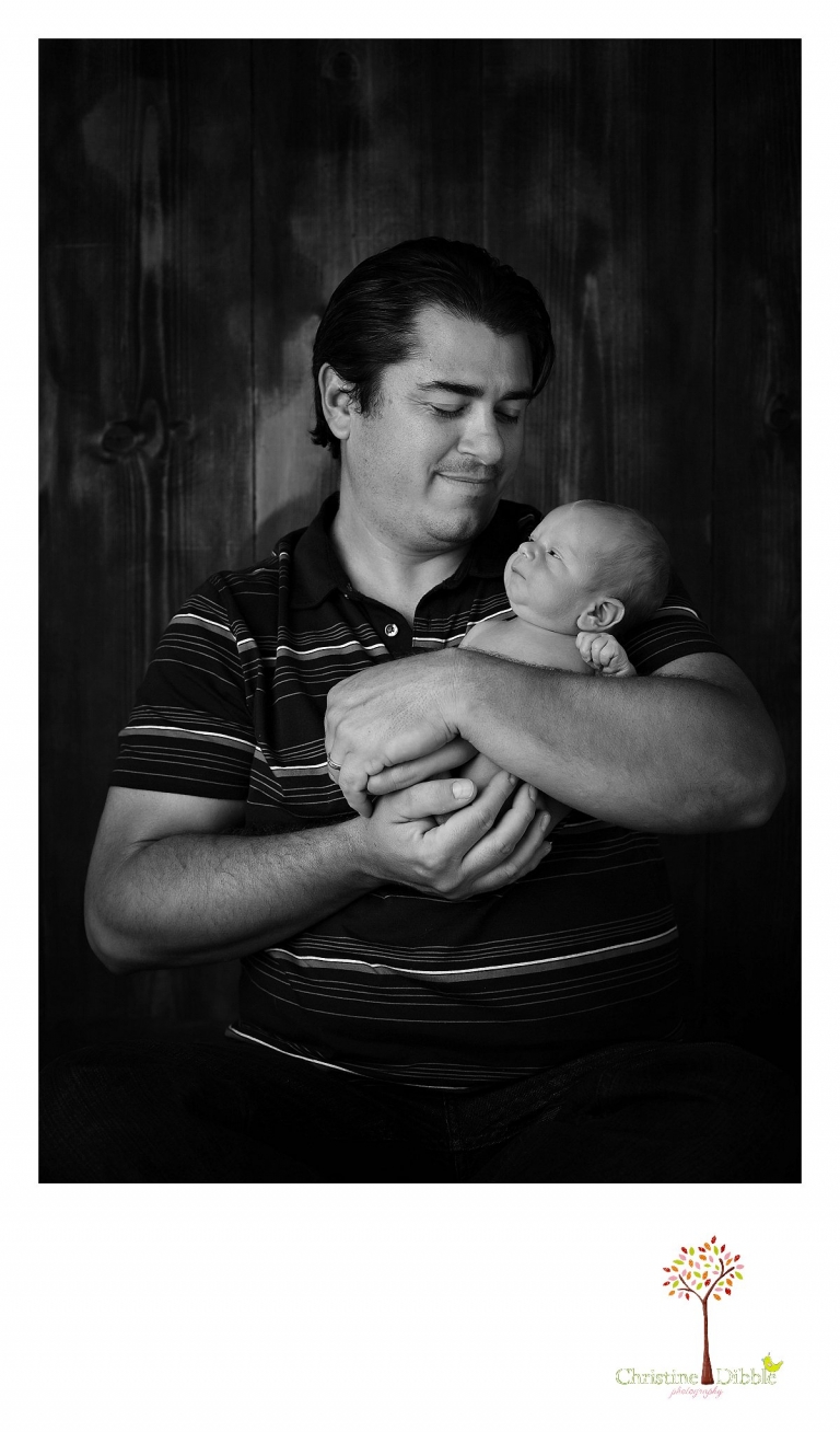 Best Sonora newborn photographer Christine Dibble Photography takes photos of a nine day old baby boy in dad's arms.
