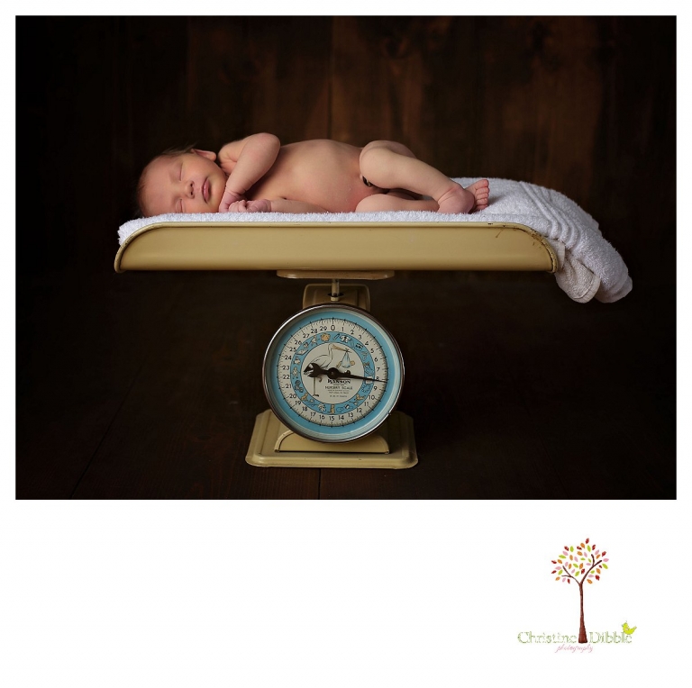 Sonora newborn photographer Christine Dibble Photography takes photos of a baby girl sleeping on an antique baby scale.