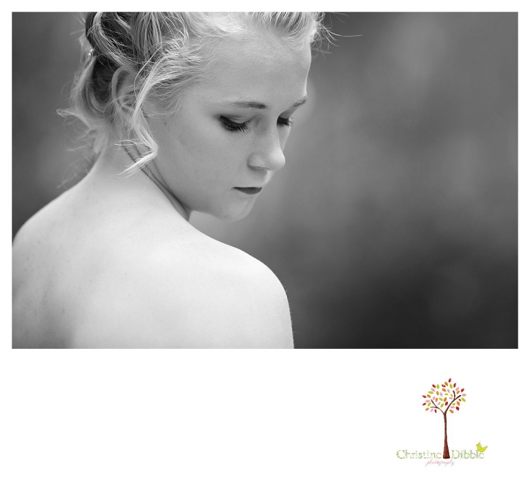 Sonora senior portrait photographer Christine Dibble Photography takes portraits of an eighth grade graduate in a formal gown showing eyelashes in a black and white head shot.