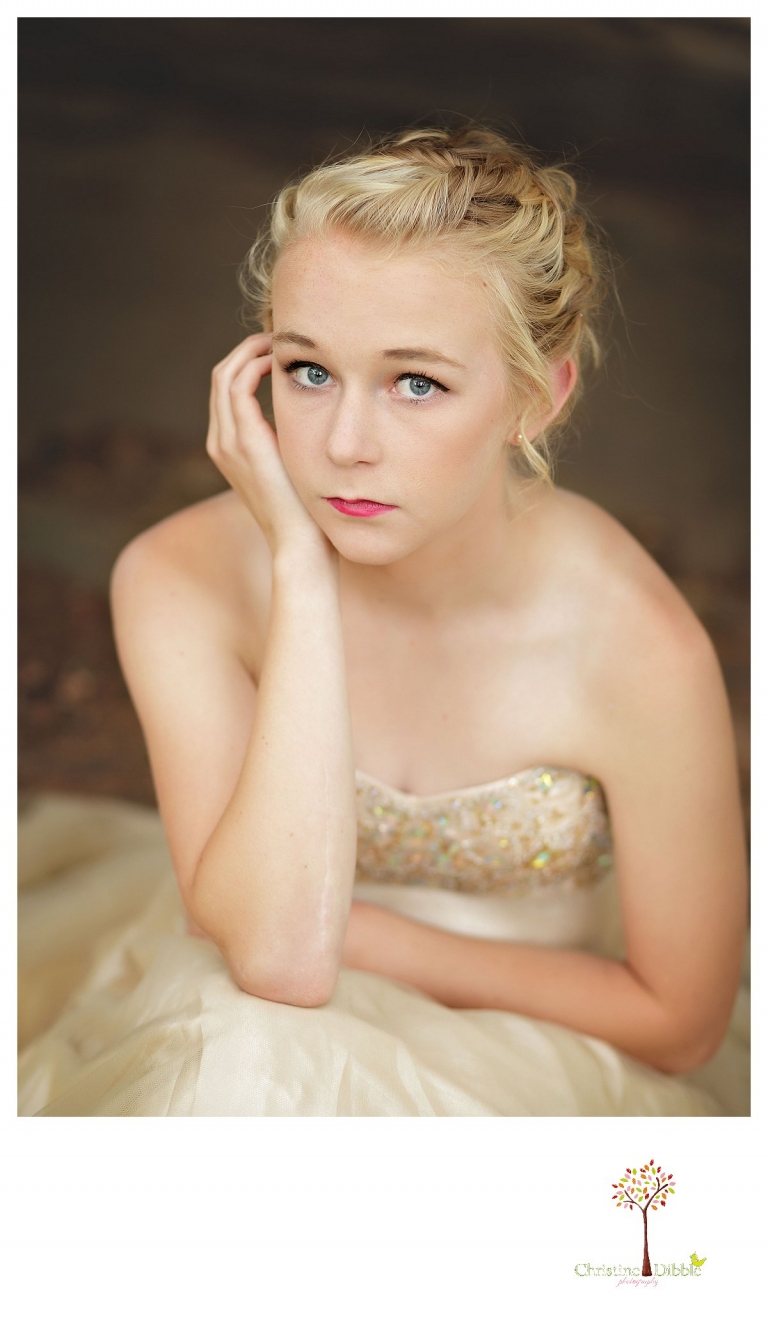 Sonora senior portrait photographer Christine Dibble Photography takes portraits of an eighth grade graduate in a formal gown as she poses for a head shot.