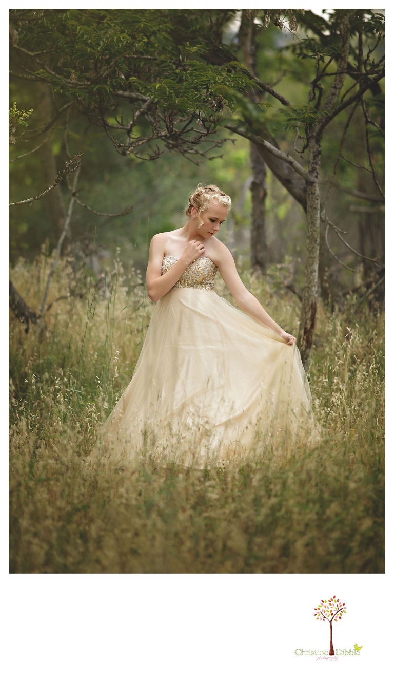 Sonora senior portrait photographer Christine Dibble Photography takes portraits of an eighth grade graduate in a formal gown standing in the woods.