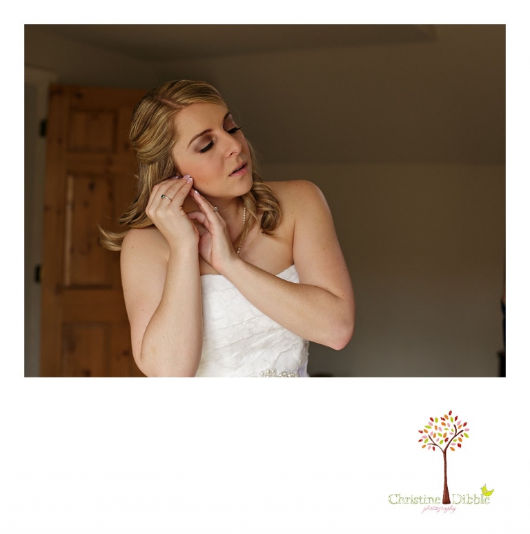 Sonora, CA wedding photography by Christine Dibble Photography captures a bride as she puts her earrings on before her wedding.