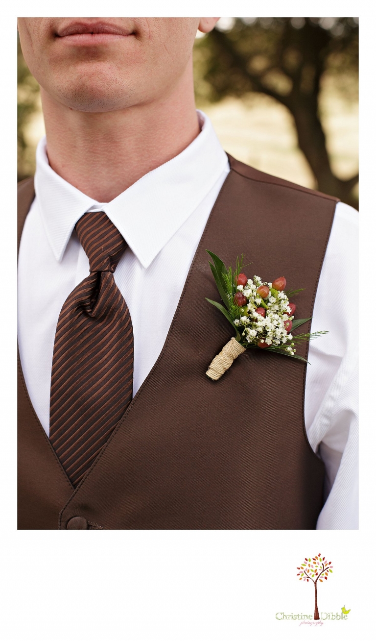 Sonora, CA wedding photography by Christine Dibble Photography photographs a rose hip boutonniere worn by the groom.