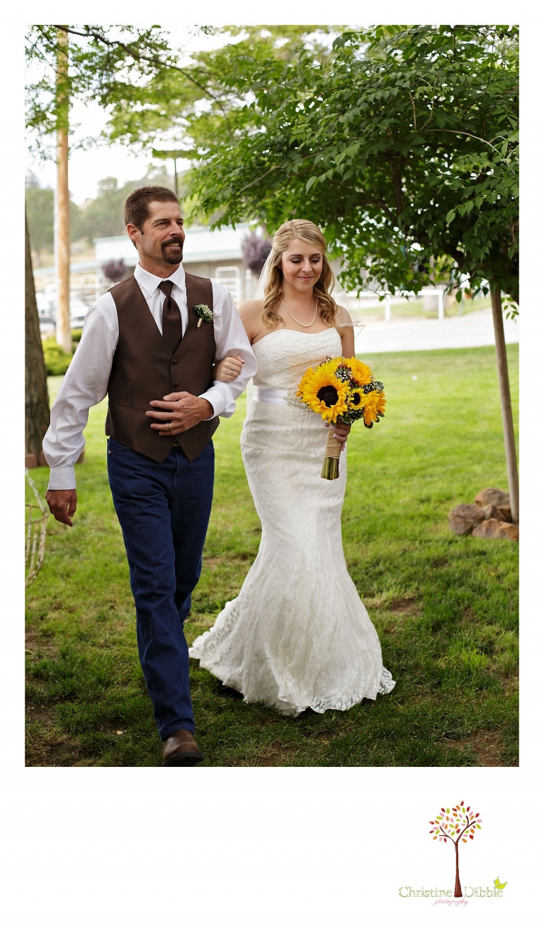 Sonora, CA wedding photography by Christine Dibble Photography photographs a dad walking his daughter down the aisle to give her away at her wedding.