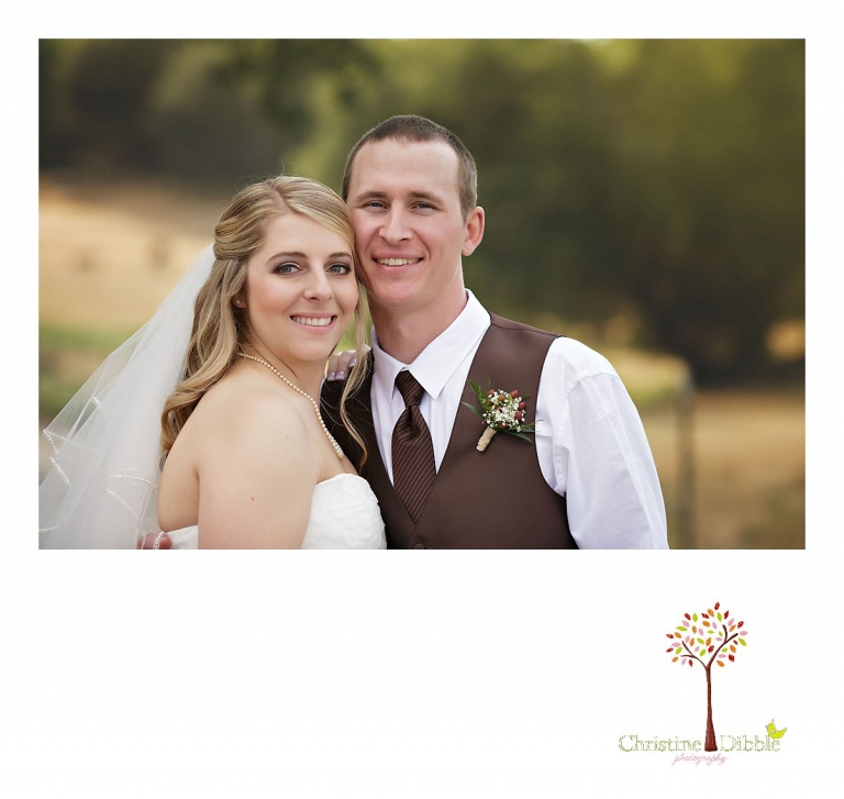 Sonora, CA wedding photographer Christine Dibble Photography photographs a bride and groom as they cuddle on a dirt road at their Mother Lode Ranch wedding.