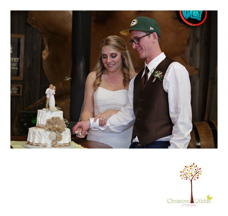 Sonora, CA wedding photographer Christine Dibble Photography photographs a bride and groom as they cut their cake.