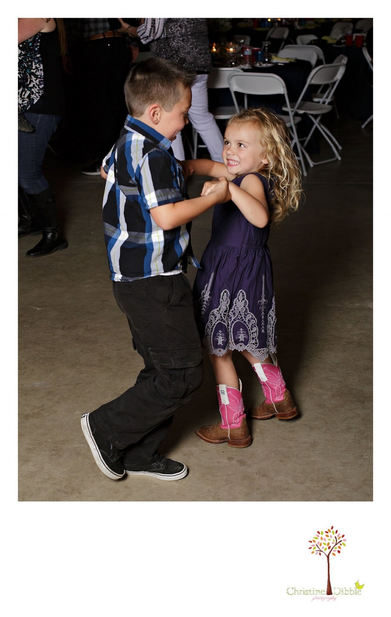 Sonora, CA wedding photographer Christine Dibble Photography photographs a little boy and girl dancing at a wedding.