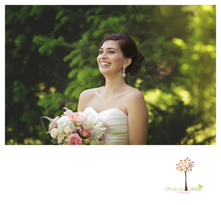 Sonora wedding photographer Christine Dibble Photography photographs a Twain Harte Tree Farm wedding and the bride during portraits among the trees.