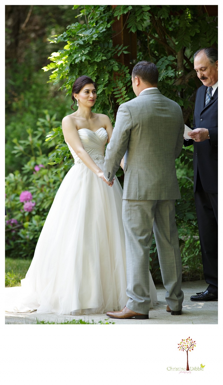 Sonora wedding photographer Christine Dibble Photography photographs a Twain Harte Tree Farm wedding during the ceremony.