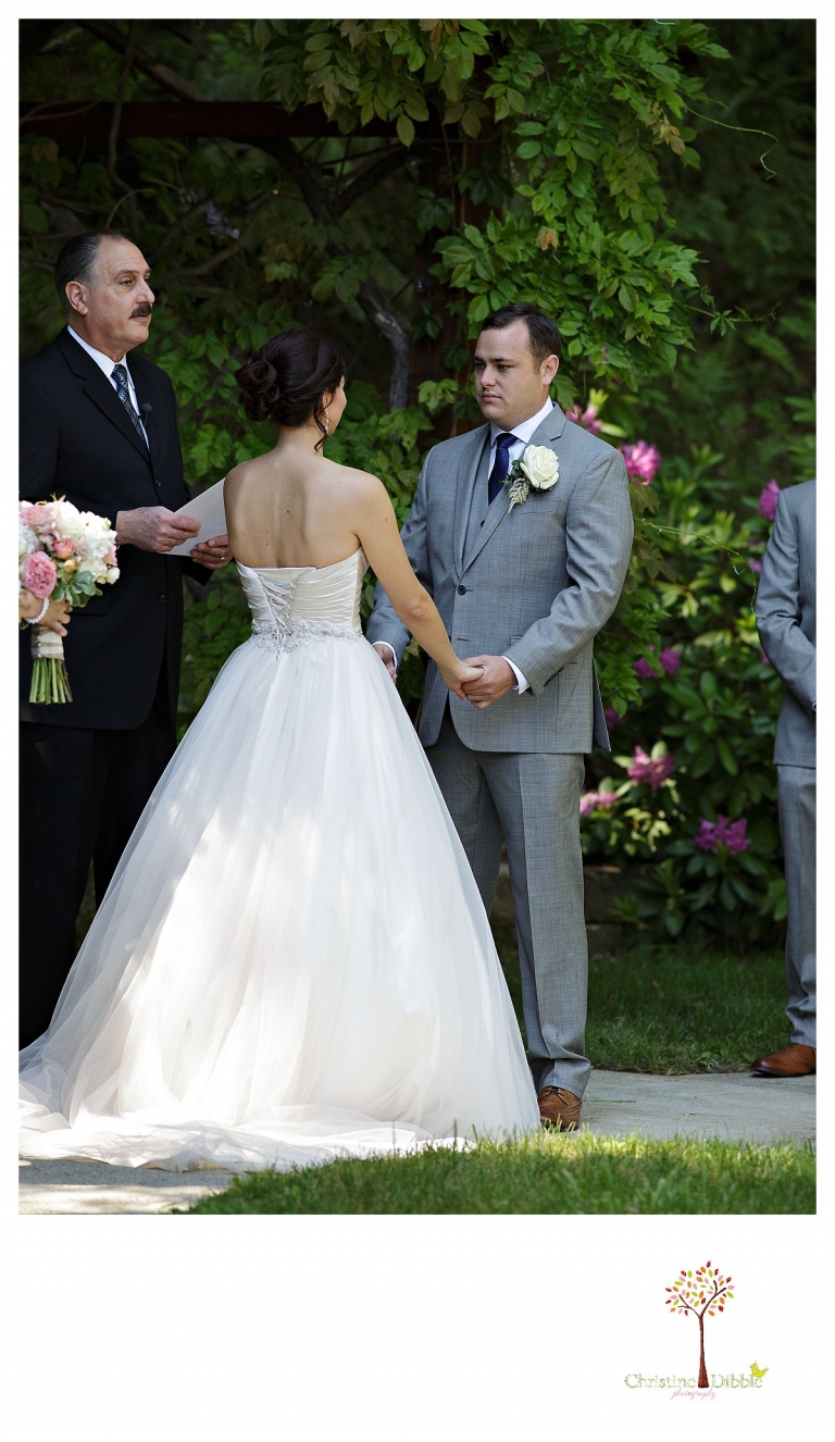 Sonora wedding photographer Christine Dibble Photography photographs a Twain Harte Tree Farm wedding and the groom as he says his vows.