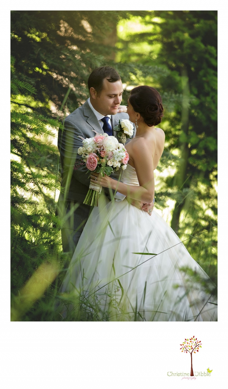 Sonora wedding photographer Christine Dibble Photography photographs a Twain Harte Tree Farm wedding and the groom looking at the bride during a private moment.