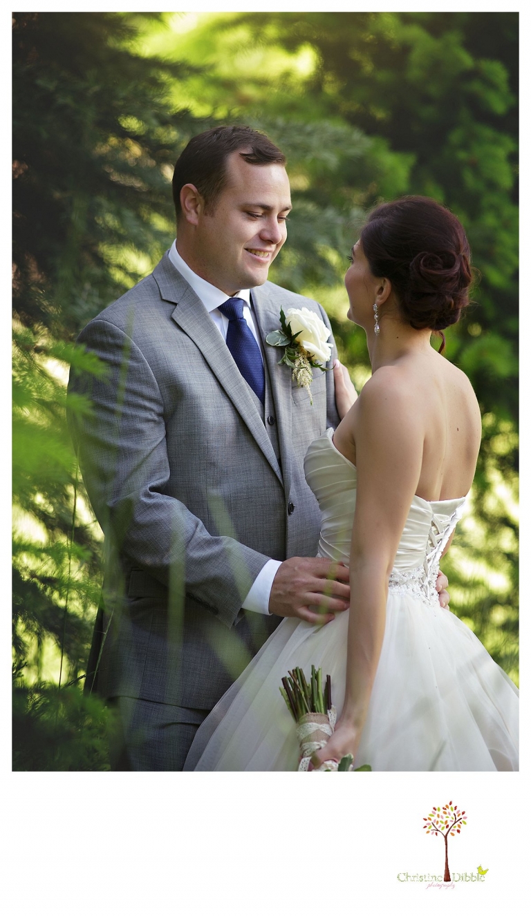 Sonora wedding photographer Christine Dibble Photography photographs a Twain Harte Tree Farm wedding and the bride and groom in a wooded area.