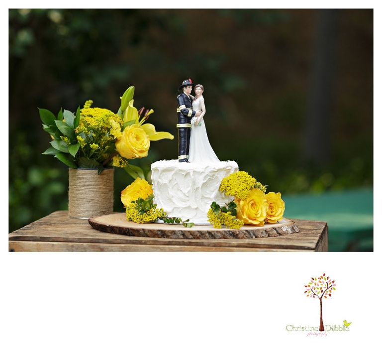 Sonora wedding photographer Christine Dibble Photography photographs a Twain Harte Tree Farm wedding and the wedding cake with the fireman cake topper.
