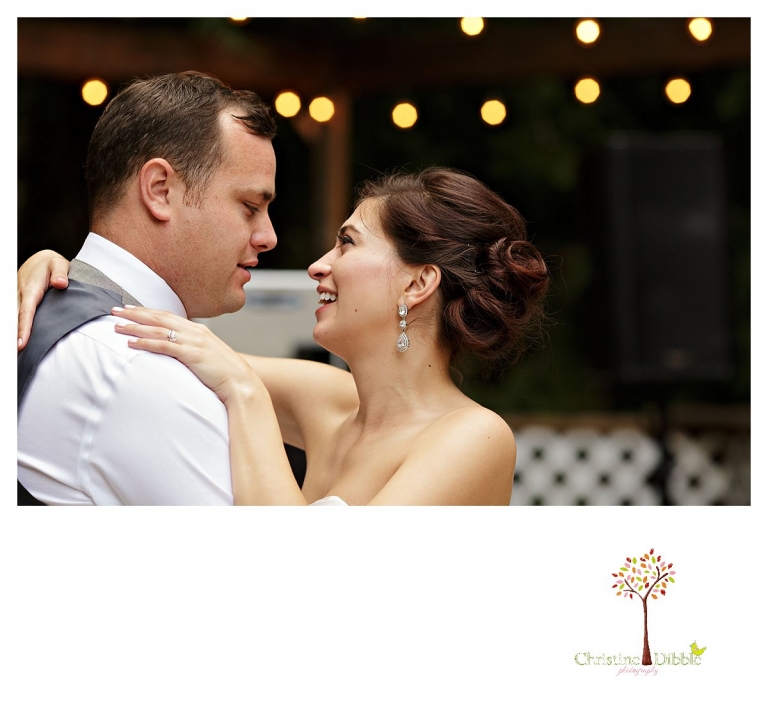 Sonora wedding photographer Christine Dibble Photography photographs a Twain Harte Tree Farm wedding and the bride looking lovingly at the groom during their first dance.