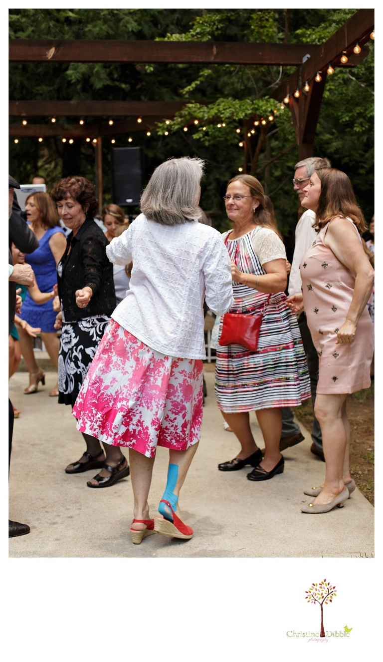 Sonora wedding photographer Christine Dibble Photography photographs a Twain Harte Tree Farm wedding and guests dancing.