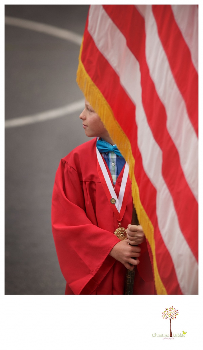 Sonora graduation and senior portrait photographer Christine Dibble Photography takes eighth grade graduation photos of a cowboy in the Curtis Creek School graduation ceremony as he holds the American Flag.