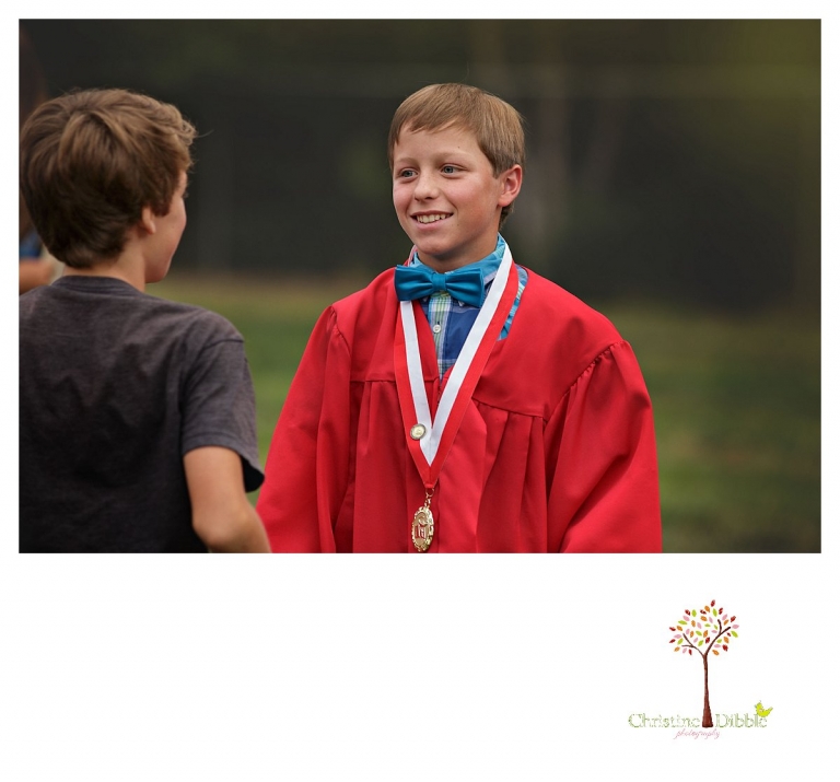 Sonora graduation and senior portrait photographer Christine Dibble Photography takes eighth grade graduation photos of a graduate as he greets friends.