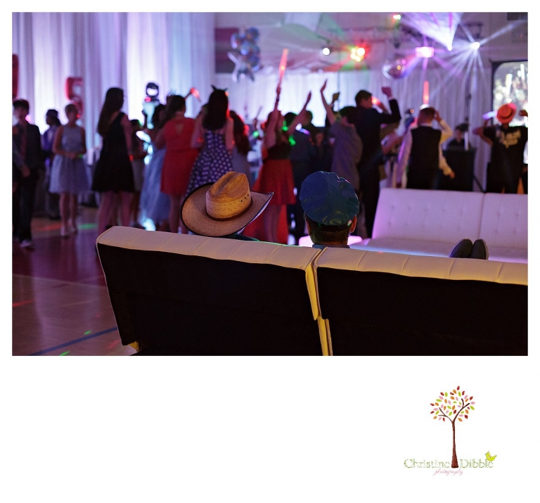 Sonora graduation and senior portrait photographer Christine Dibble Photography takes eighth grade graduation photos of a cowboy in the after party.