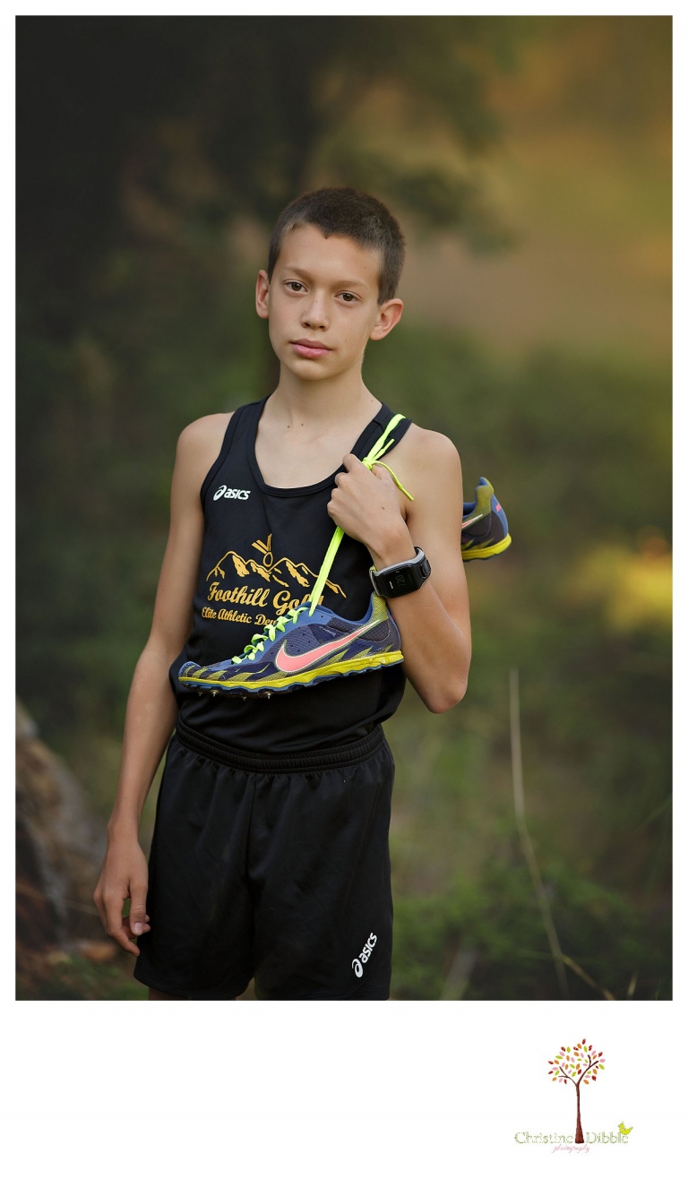 Sonora family photographer Christine Dibble Photography takes family portraits of a family celebrating their daughter's college graduation and son's eighth grade graduation and he wears his Foothill Gold track uniform.
