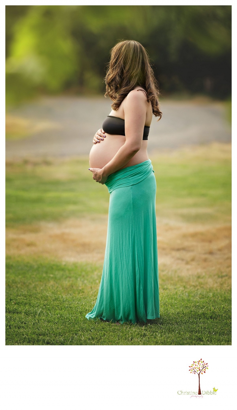 Sonora maternity photography session by Christine Dibble Photography shows a pregnant woman wearing a maxi skirt and tank top for a maternity session.