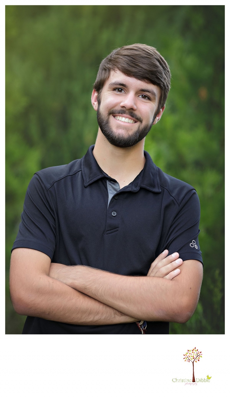 Sonora and Summerville senior portrait photographer Christine Dibble Photography takes senior portraits of a boy at Twain Harte Tree Farm where he works.