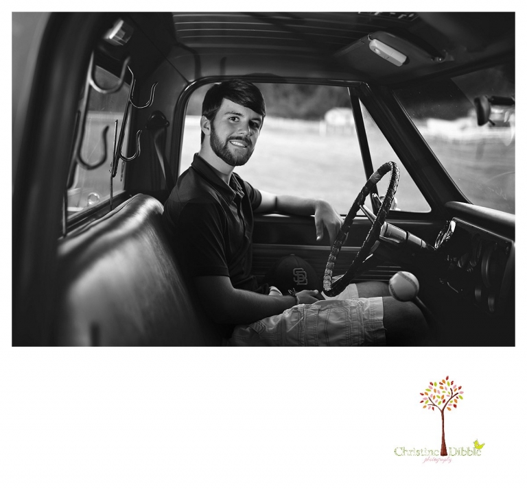 Sonora and Summerville senior portrait photographer Christine Dibble Photography takes senior portraits of a boy at Twain Harte Tree Farm, including a black and white image of him behind the wheel of his Chevy truck.