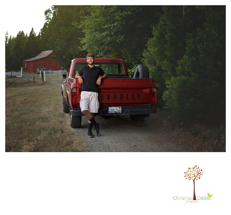 Sonora and Summerville senior portrait photographer Christine Dibble Photography takes senior portraits of a boy leaning on the tailgate of his older Chevy truck at Twain Harte Tree Farm.