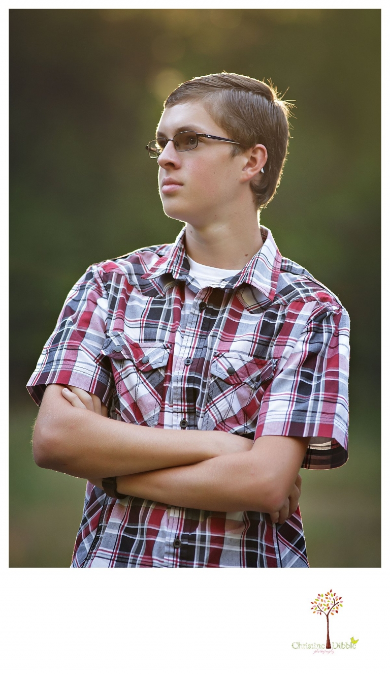 Christine Dibble Photography, Summerville and Sonora senior portrait photographer, takes photos of a boy as he looks off into the distance.