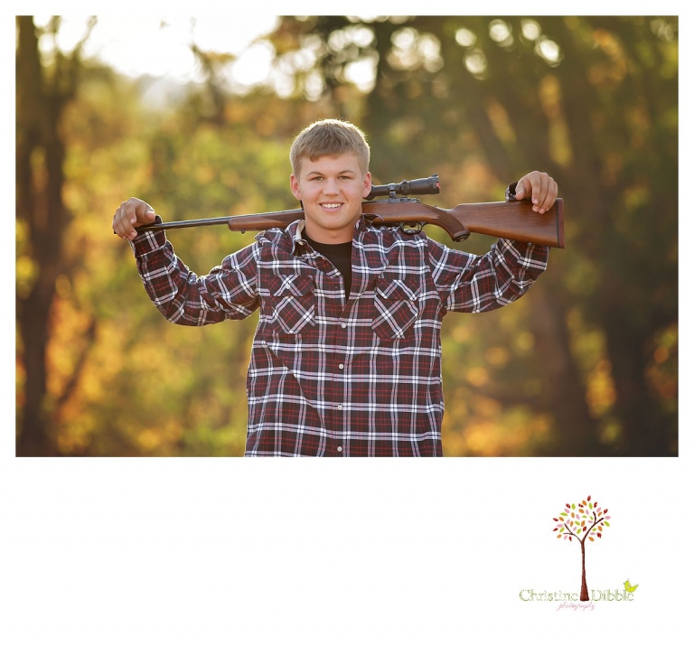 Summerville senior portrait photographer, Christine Dibble Photography of Sonora, takes photos of a boy with his hunting rifle over both shoulders.