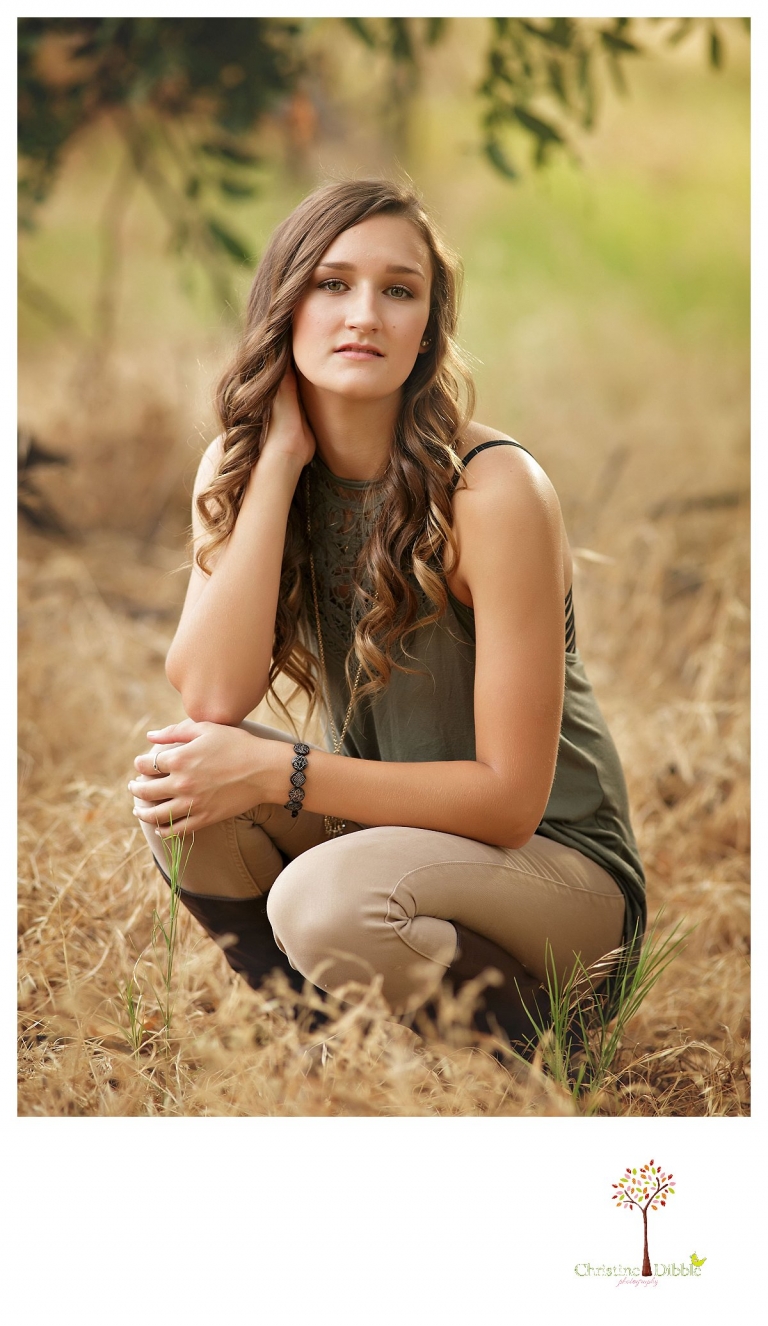 Summerville and Sonora senior portrait photographer Christine Dibble Photography takes photos of a senior girl in a field at Knights Ferry.