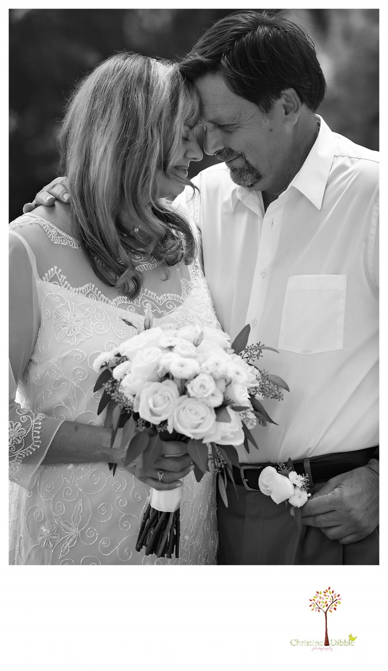 Wedding photography in Sonora by Christine Dibble Photography documents a quiet moment between a bride and groom before their wedding at Twain Harte Tree Farm.