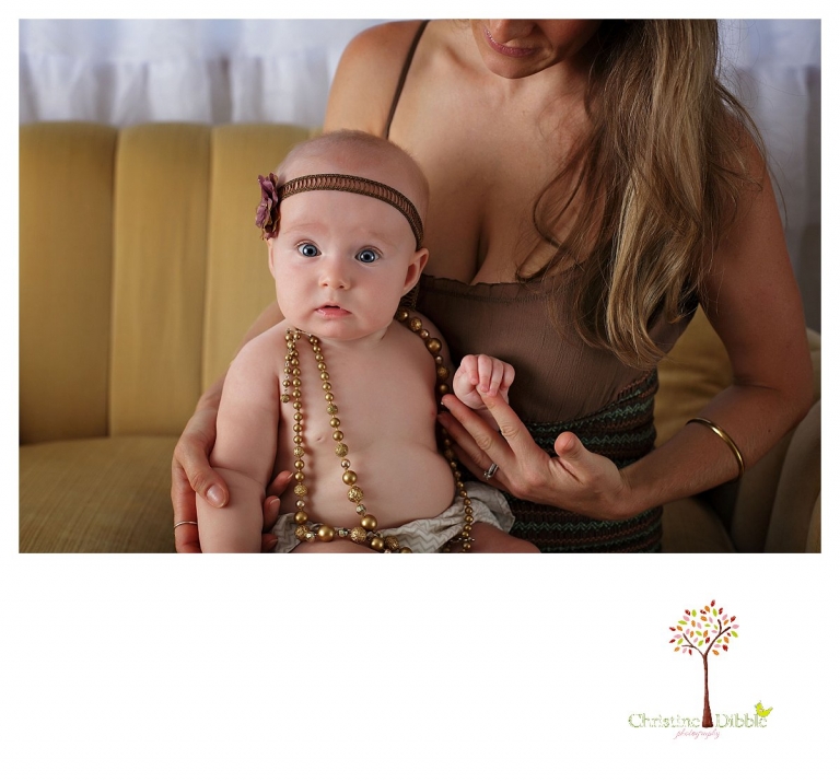 Sonora baby photographer Christine Dibble Photography takes studio portraits for a mommy and me session of a baby girl in beads and headbands.