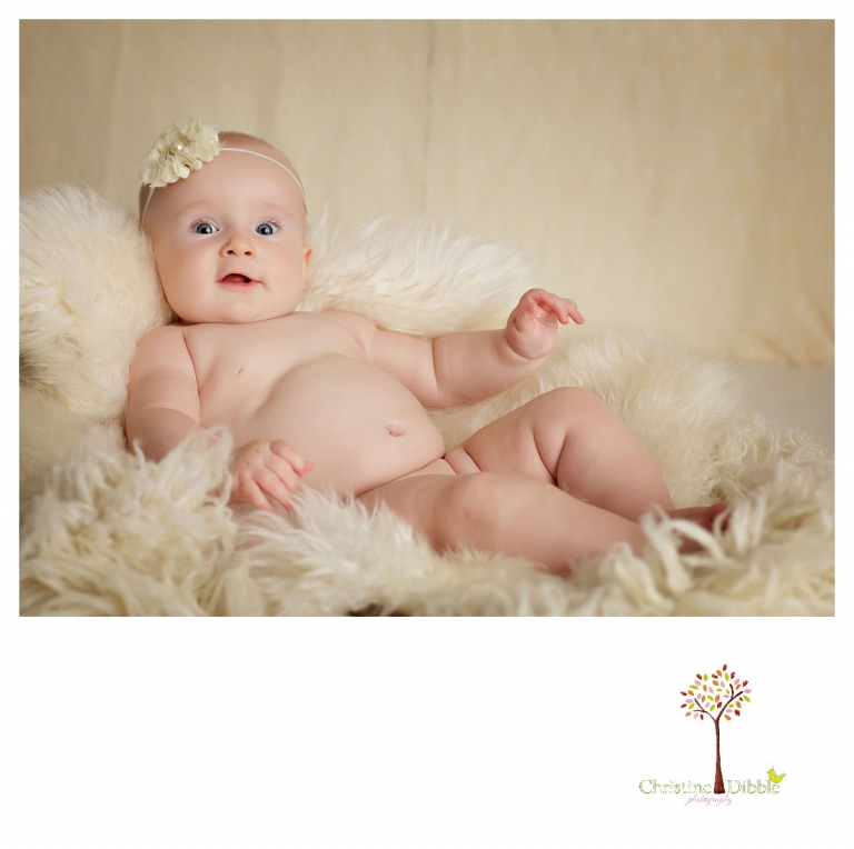 Sonora baby photographer Christine Dibble Photography takes studio portraits for a mommy and me session of a baby girl who cannot sit up yet.